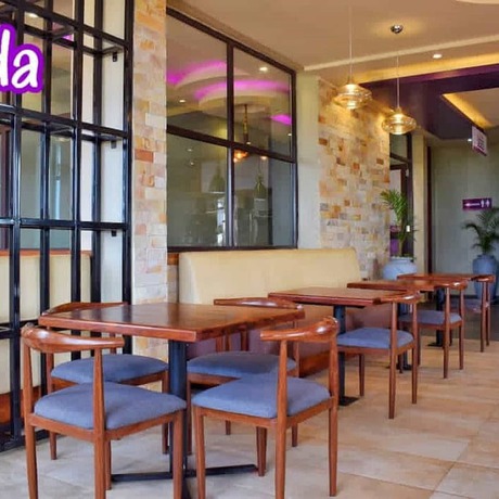 Imagen del bar/restaurante del Hotel Tenda Suites and Restaurant. Foto 10