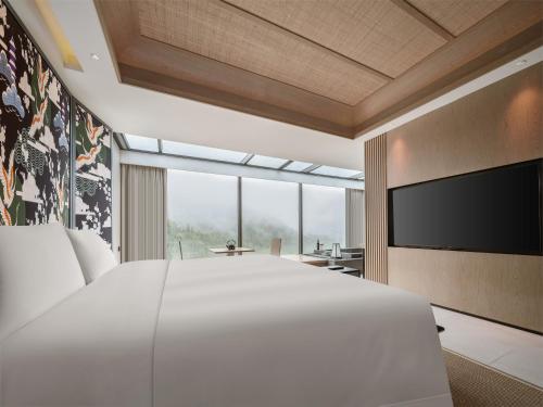 Imagen de la habitación del Hotel Tengchong Jingge Banshan Hot Spring. Foto 20