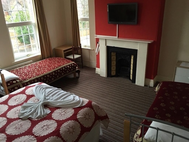 Imagen de la habitación del Hotel Tennyson House. Foto 17