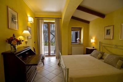 Imagen de la habitación del Hotel Tenuta Del Poggio Antico. Foto 2