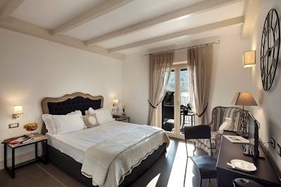 Imagen de la habitación del Hotel Tenuta Del Poggio Antico. Foto 4