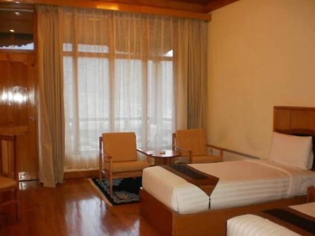 Imagen de la habitación del Hotel Tenzinling Resort. Foto 19