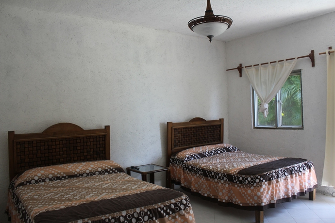 Imagen de la habitación del Hotel Teques Inn. Foto 2