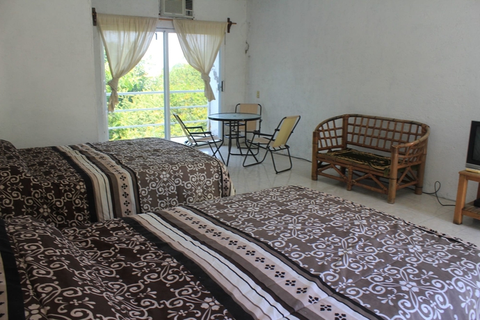 Imagen de la habitación del Hotel Teques Inn. Foto 3