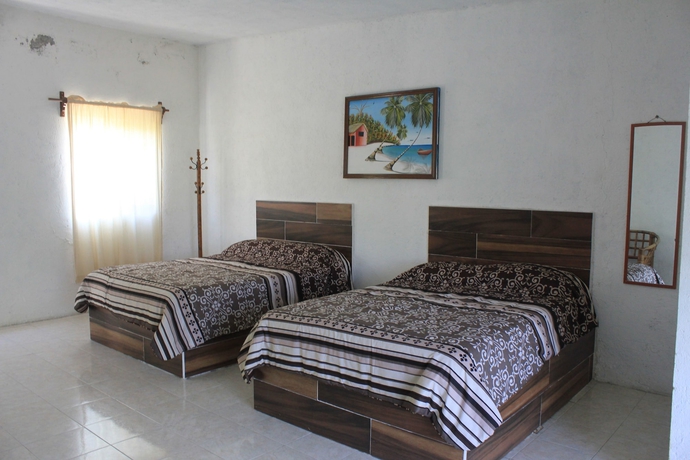 Imagen de la habitación del Hotel Teques Inn. Foto 5