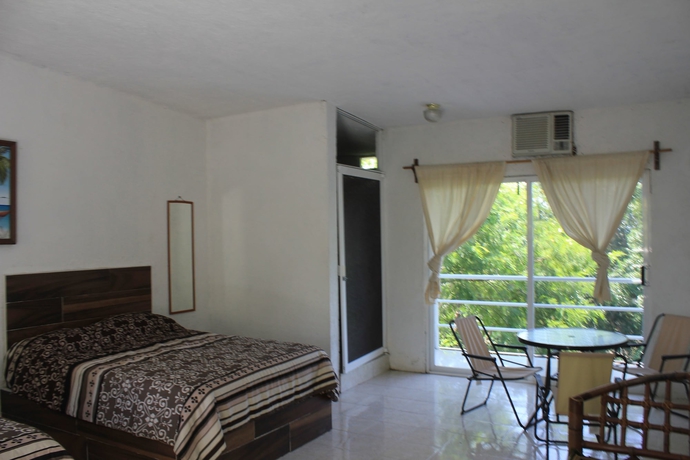 Imagen de la habitación del Hotel Teques Inn. Foto 7