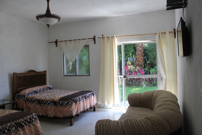 Imagen de la habitación del Hotel Teques Inn. Foto 8