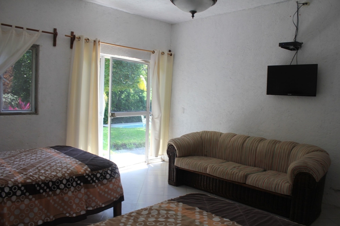 Imagen de la habitación del Hotel Teques Inn. Foto 10