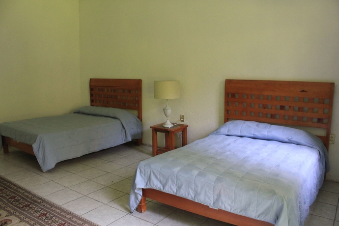 Imagen de la habitación del Hotel Teques Inn. Foto 11