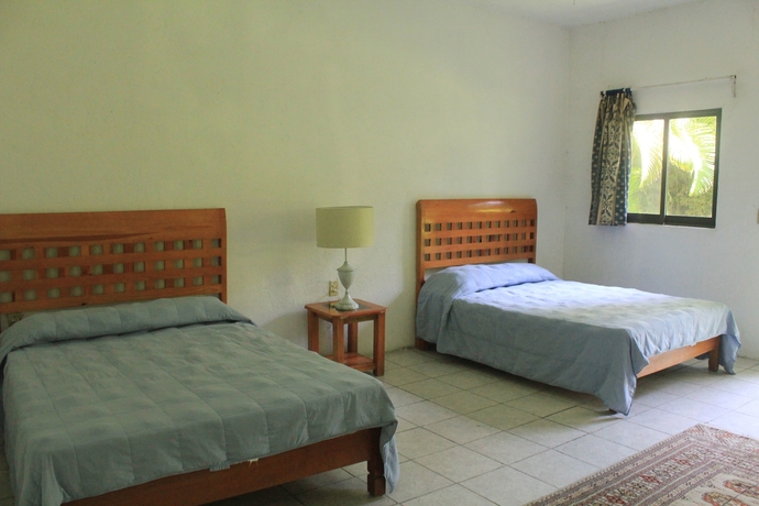 Imagen de la habitación del Hotel Teques Inn. Foto 12