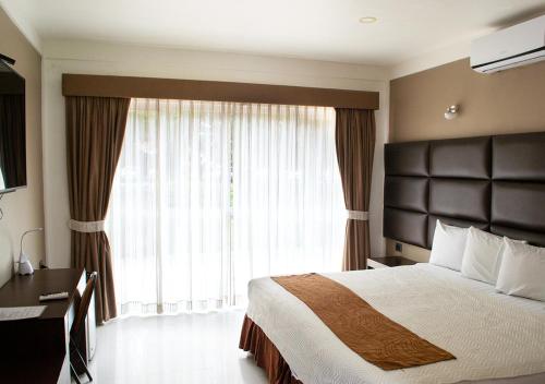 Imagen de la habitación del Hotel Terramia Resort. Foto 15