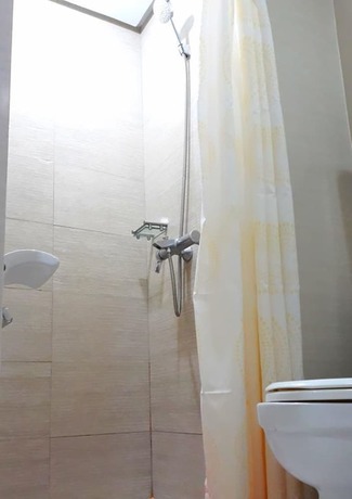 Imagen de la habitación del Hotel Tess And Tessha Condotel. Foto 13