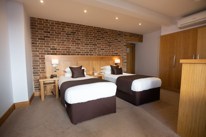 Imagen de la habitación del Hotel Tewinbury. Foto 17