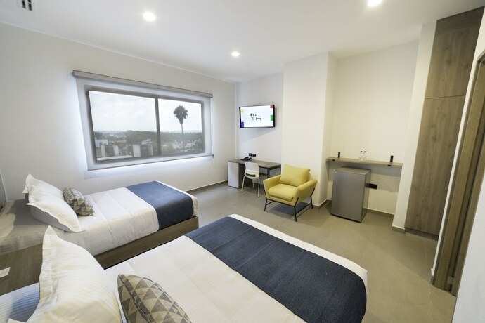 Imagen de la habitación del Hotel Th And Vivienda. Foto 17