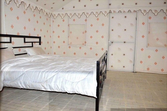 Imagen de la habitación del Hotel Thakur Ji Resort. Foto 12