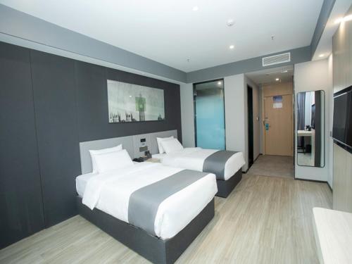 Imagen de la habitación del Hotel Thank Inn Changsha Ningxiang Avenue High-Speed Railway Station. Foto 14