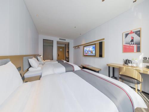 Imagen de la habitación del Hotel Thank Inn Linyi Jiaxing Fruit Market. Foto 18