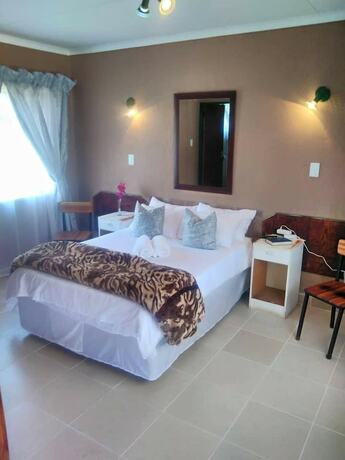 Imagen de la habitación del Hotel Thatch Palace Lodge. Foto 17