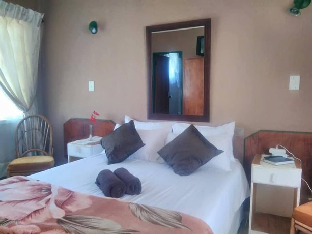 Imagen de la habitación del Hotel Thatch Palace Lodge. Foto 19