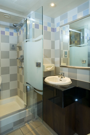 Imagen de la habitación del Hotel Thatcher's. Foto 10