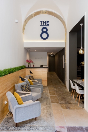 Imagen del bar/restaurante del Hotel The 8 Downtown Suites. Foto 7