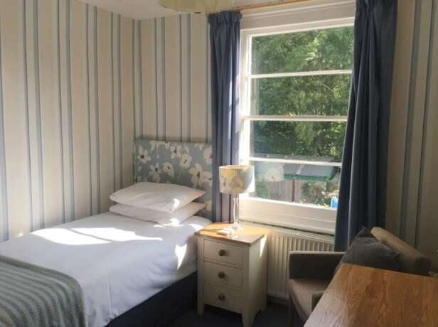 Imagen de la habitación del Hotel The Abbey. Foto 11