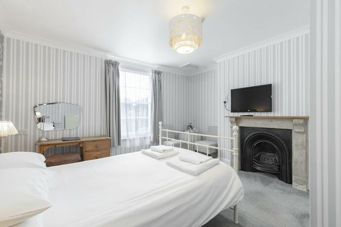 Imagen de la habitación del Hotel The Abbey. Foto 16