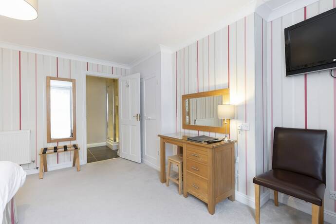 Imagen de la habitación del Hotel The Abbey. Foto 18