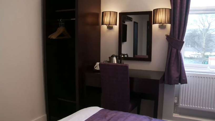 Imagen de la habitación del Hotel The Abbey Lodge. Foto 9