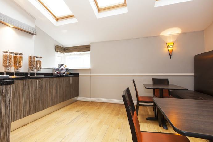 Imagen del bar/restaurante del Hotel The Abbey Lodge. Foto 4