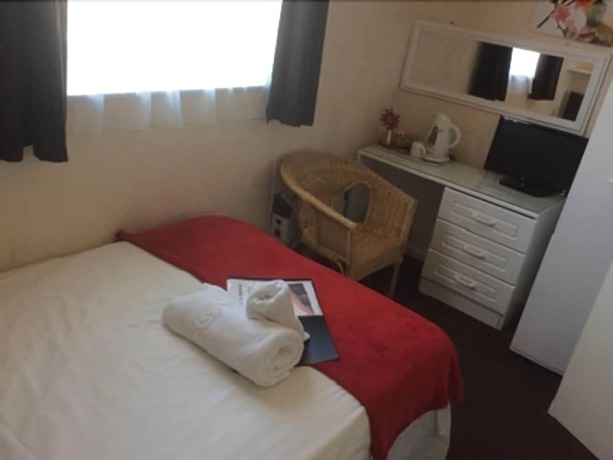 Imagen de la habitación del Hotel The Aberford. Foto 10