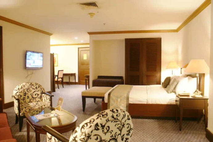 Imagen de la habitación del Hotel The Acacia Jakarta. Foto 14