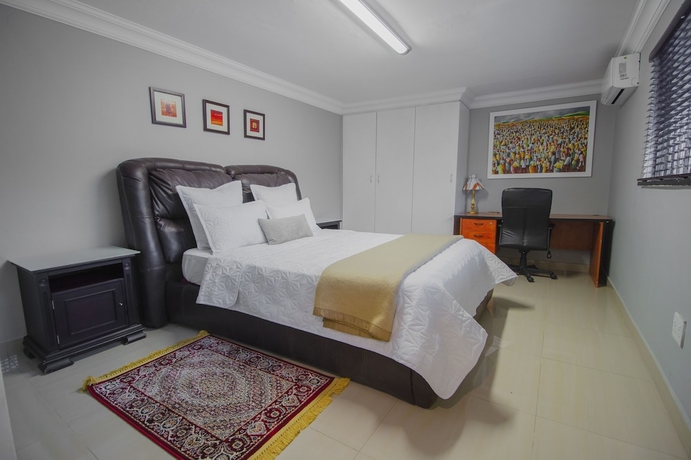 Imagen de la habitación del Hotel The Afropolitan. Foto 4