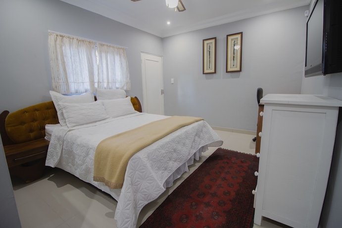 Imagen de la habitación del Hotel The Afropolitan. Foto 11