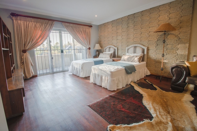 Imagen de la habitación del Hotel The Afropolitan. Foto 17