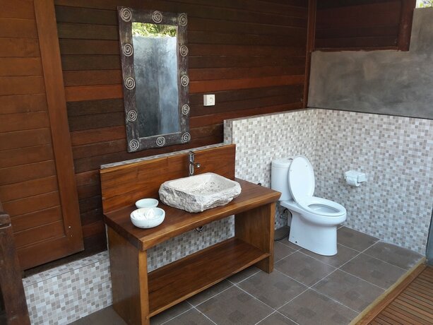 Imagen de la habitación del Hotel The Akah Cottage. Foto 23