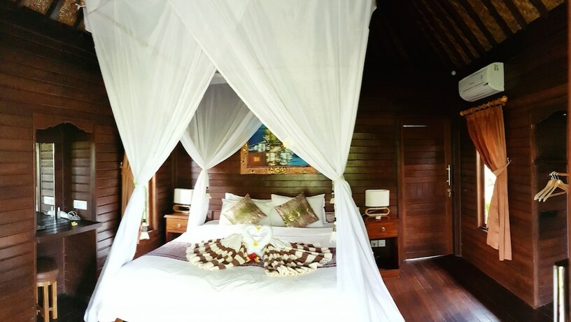 Imagen de la habitación del Hotel The Akah Cottage. Foto 24
