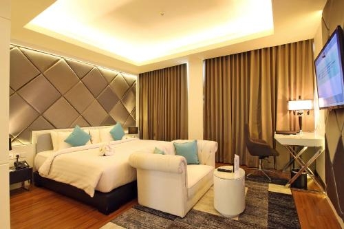Imagen de la habitación del Hotel The Alana & Convention Center Solo. Foto 10