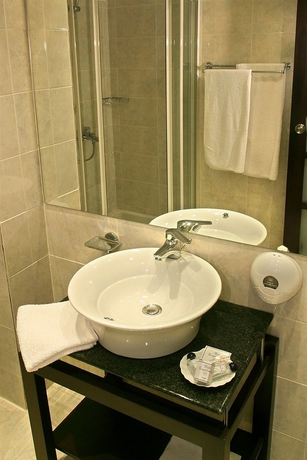 Imagen de la habitación del Hotel The Alassia. Foto 9