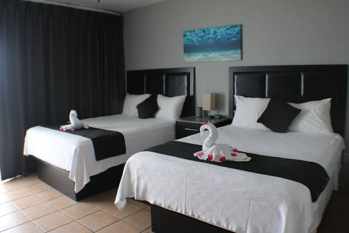 Imagen de la habitación del Hotel The All New Grace Bay Suites. Foto 5