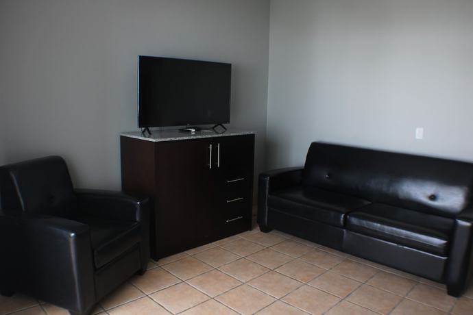 Imagen de la habitación del Hotel The All New Grace Bay Suites. Foto 6