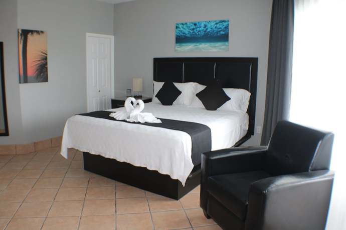 Imagen de la habitación del Hotel The All New Grace Bay Suites. Foto 8