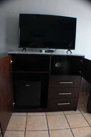 Imagen de la habitación del Hotel The All New Grace Bay Suites. Foto 13