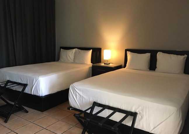 Imagen de la habitación del Hotel The All New Grace Bay Suites. Foto 16