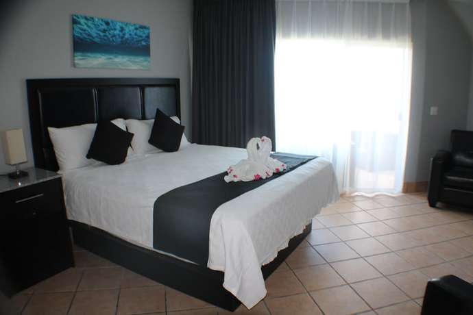 Imagen de la habitación del Hotel The All New Grace Bay Suites. Foto 17
