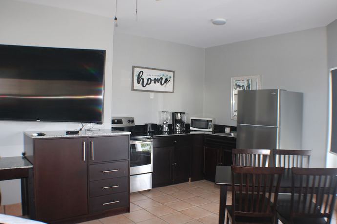 Imagen de la habitación del Hotel The All New Grace Bay Suites. Foto 19