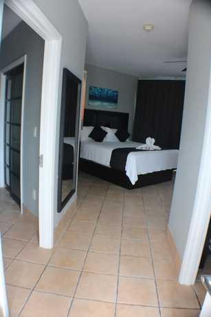 Imagen de la habitación del Hotel The All New Grace Bay Suites. Foto 20
