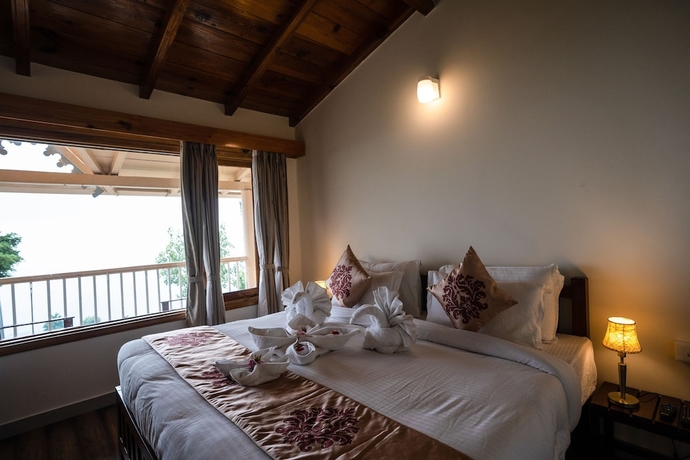 Imagen de la habitación del Hotel The Alpine Chalet Resort. Foto 4