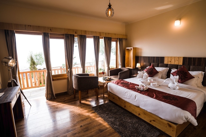 Imagen de la habitación del Hotel The Alpine Chalet Resort. Foto 6