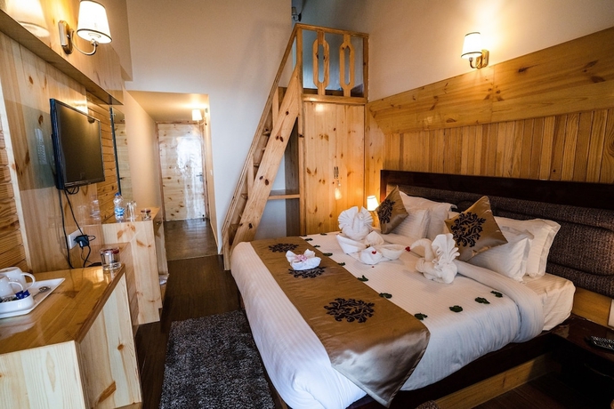 Imagen de la habitación del Hotel The Alpine Chalet Resort. Foto 10